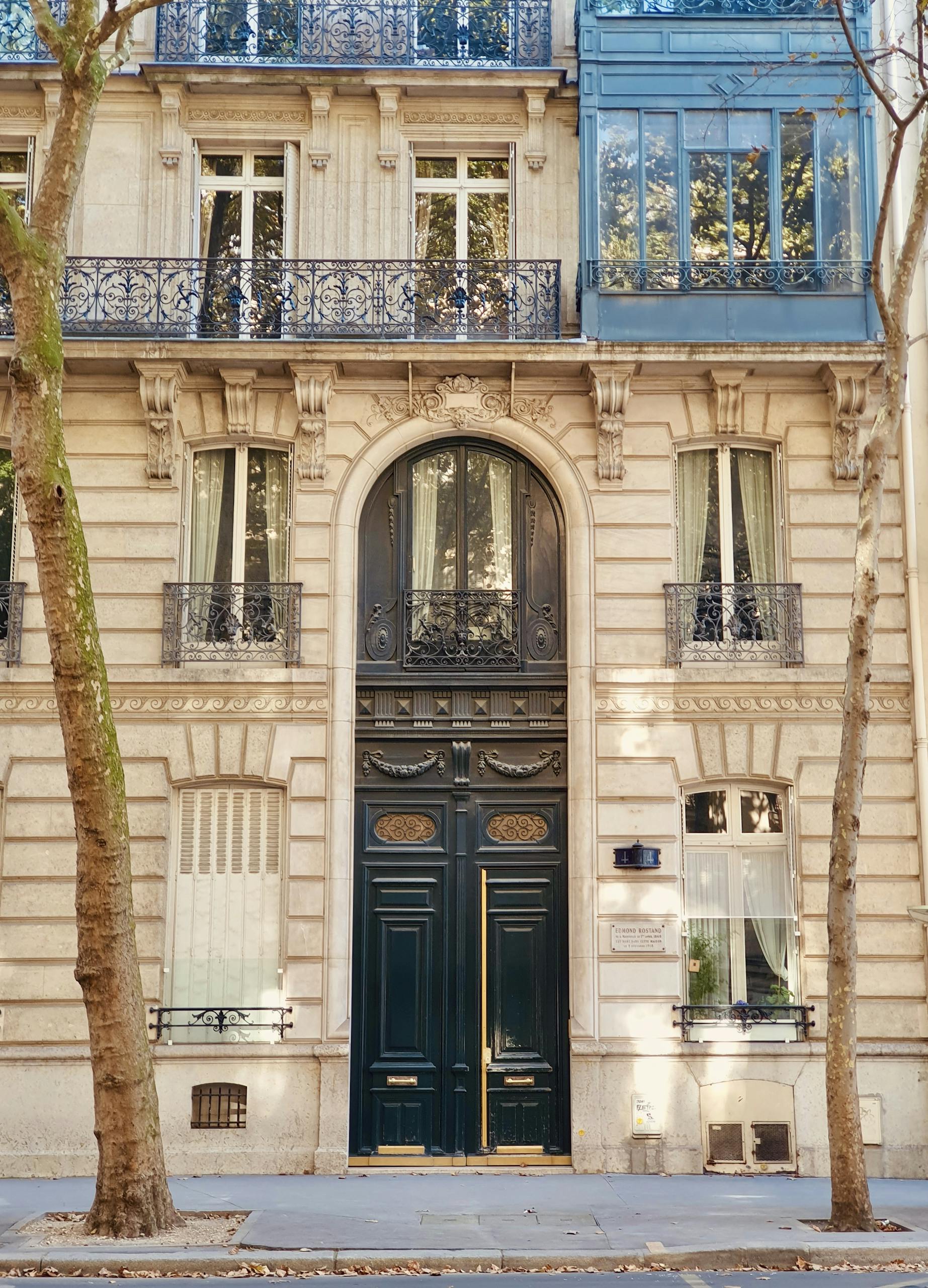 Elegant Haussmann-style building facade in central Paris, captured during autumn.